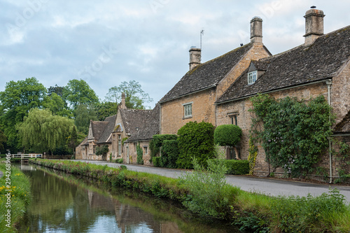 LOWER SLAUGHTER, COTSWOLDS, GLOUCESTERSHIRE, ENGLAND - MAY, 27 2018: Typical Cotswold cottages on the River Eye, Lower Slaughter, Gloucestershire, Cotswolds, England, UK