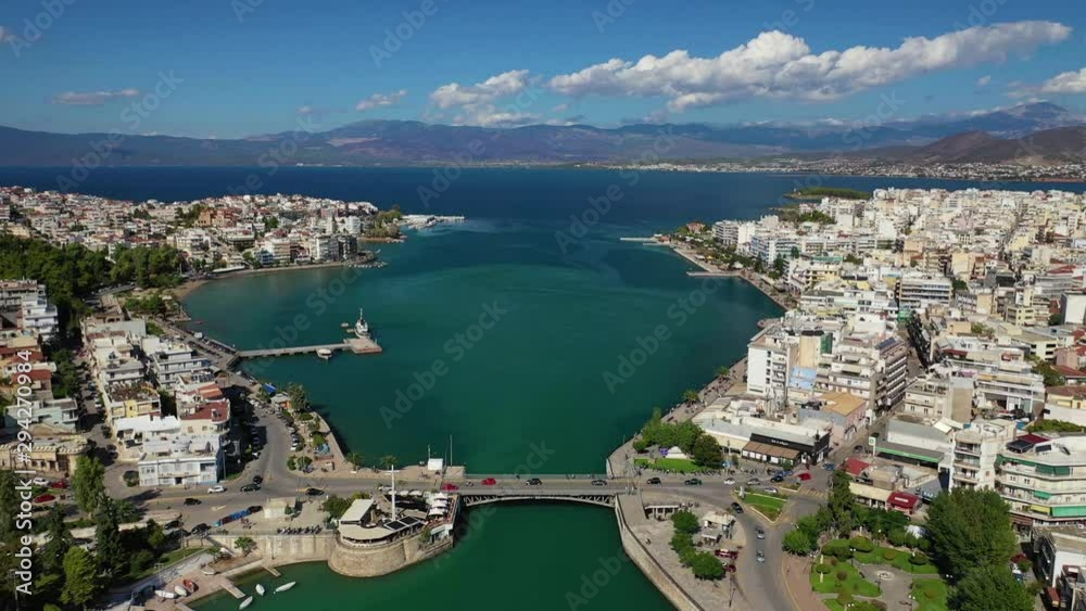 Aerial drone video of iconic town of Halkida or Chalkida with famous old bridge connecting Evoia island with mainland and beautiful clouds, Greece Aerial drone video of iconic town of Halkida or Chalkida with famous old bridge connecting Evoia island with mainland and beautiful clouds, Greece