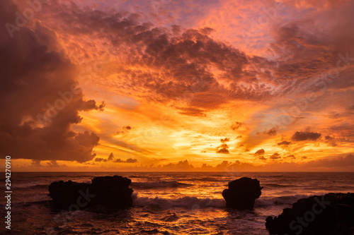 Amazing colorful bright tropical sunset in Bali island. Red colored clouds.