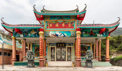 Bang Phra, Thailand - March 16, 2019: Chao Pho Khao Chalak Chinese Cemetery. Closeup of Reunion hall and shrine for mourning families in elaborate architecture and colorful decorations.