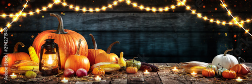 Wooden Table With Lantern And Candles Decorated With Pumpkins, Corncobs, Apples And Gourds - Thanksgiving / Harvest Concept