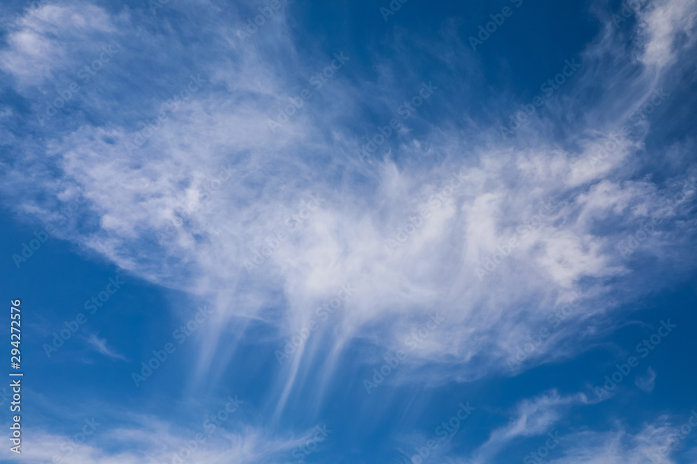 Light clouds streaking against a blue sky Light clouds streaking against a blue sky