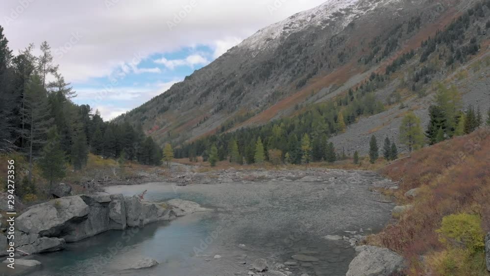 Mountain river and lake surrounded by stones and rocks. Landscape mountain creek or river. Mountain river and lake surrounded by stones and rocks. Landscape mountain creek or river.
