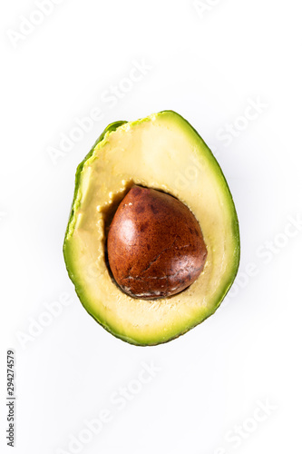 A ripe avocado fruit cut in two. Top view, close-up.
