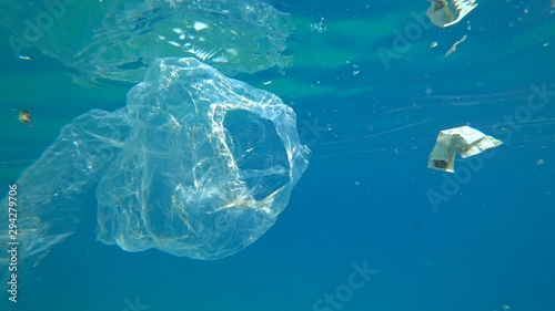 Kastellorizo, Greek island - 1st of October 2019: 4K Plastic wrap and other litter suspended underwater photo