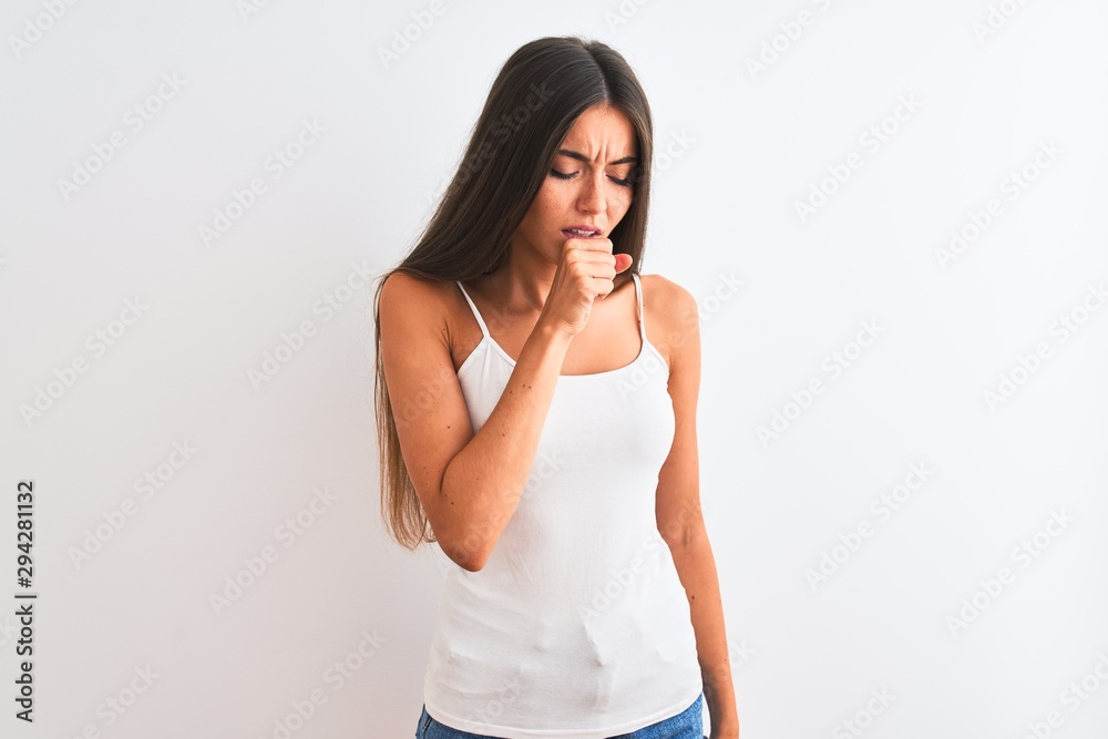 Young beautiful woman wearing casual t-shirt standing over isolated white background feeling unwell and coughing as symptom for cold or bronchitis. Healthcare concept. Young beautiful woman wearing casual t-shirt standing over isolated white background feeling unwell and coughing as symptom for cold or bronchitis. Healthcare concept.