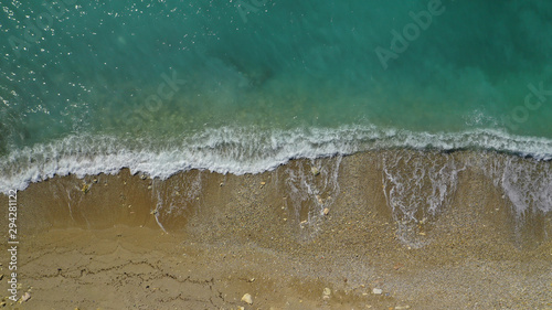 Aerial top down photo of tropical sandy beach with turquoise clear sea