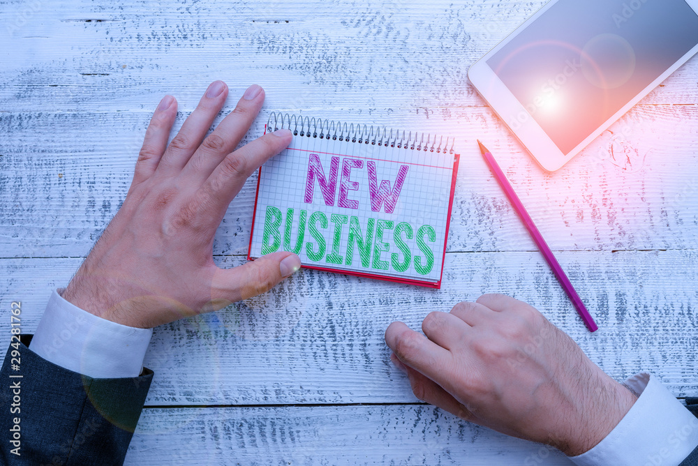 Conceptual hand writing showing New Business. Concept meaning the activity of buying and selling goods and services Conceptual hand writing showing New Business. Concept meaning the activity of buying and selling goods and services