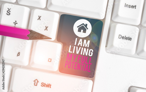 Text sign showing I Am Living My Full Potential. Business photo text Embracing opportunities using skills abilities White pc keyboard with empty note paper above white background key copy space photo