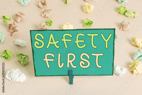 Writing note showing Safety First. Business concept for said to mean that it is best to avoid any unnecessary risks Colored crumpled papers empty reminder pink floor background clothespin