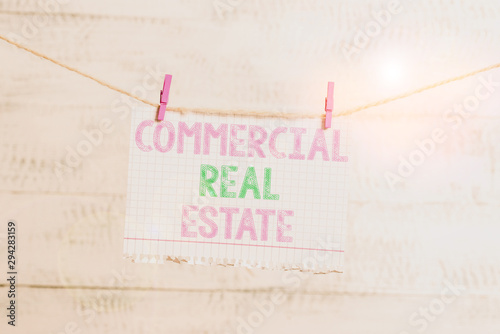 Writing note showing Commercial Real Estate. Business concept for Income Property Building or Land for Business Purpose Clothesline clothespin rectangle shaped paper reminder white wood desk