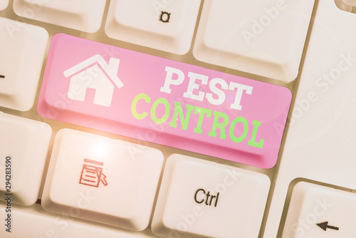 Text sign showing Pest Control. Business photo showcasing analysisagement of a species that impacts adversely on huanalysis White pc keyboard with empty note paper above white background key copy photo