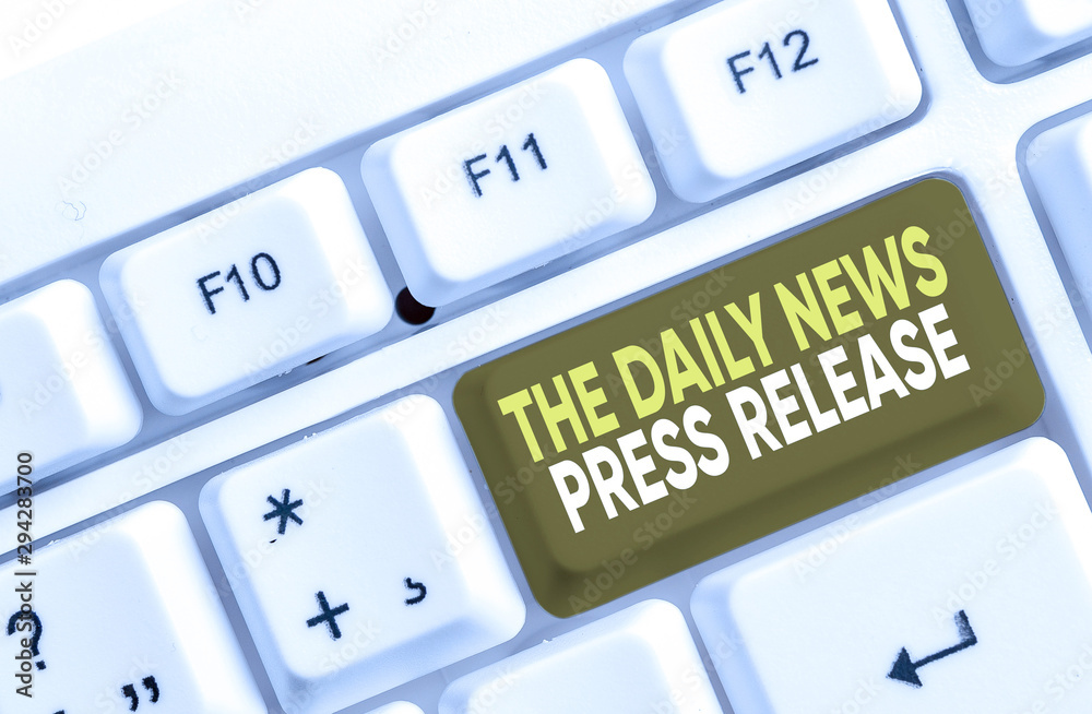 Writing note showing The Daily News Press Release. Business concept for announcing big news or speak to showing White pc keyboard with note paper above the white background Writing note showing The Daily News Press Release. Business concept for announcing big news or speak to showing White pc keyboard with note paper above the white background