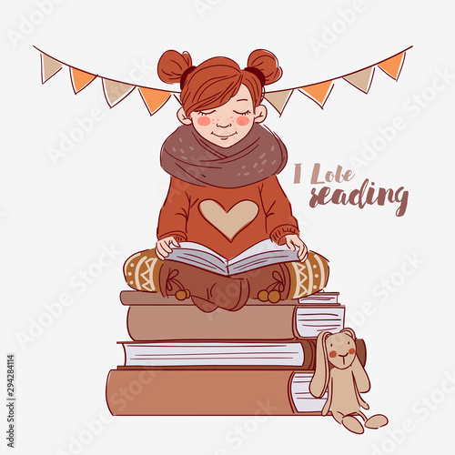 Cute girl reads a book
