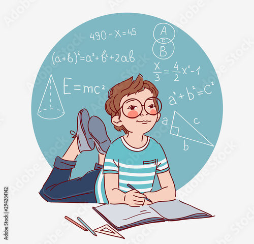 Cute boy writing in notebook. Little boy solves mathematical examples