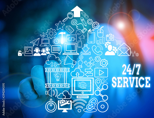 Word writing text 24 Or 7 Service. Business photo showcasing Always available to serve Runs constantly without disruption Woman wear formal work suit presenting presentation using smart device