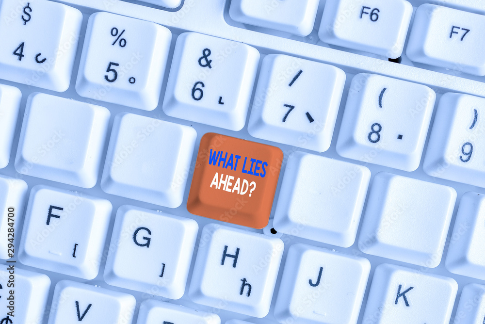 Text sign showing What Lies Ahead Question. Business photo showcasing Asking for information about something on the way White pc keyboard with empty note paper above white background key copy space Text sign showing What Lies Ahead Question. Business photo showcasing Asking for information about something on the way White pc keyboard with empty note paper above white background key copy space