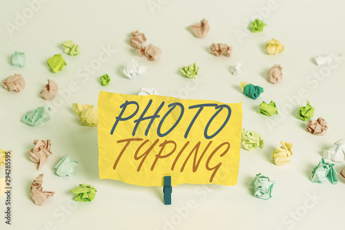 Word writing text Photo Typing. Business photo showcasing metal printing block use to reproduce a photograph in printing Colored crumpled papers empty reminder white floor background clothespin © Artur