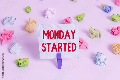Handwriting text Monday Started. Conceptual photo getting ready for new week Rest is over lets begin work Colored crumpled papers empty reminder white floor background clothespin © Artur