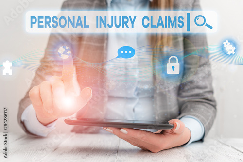 Text sign showing Personal Injury Claims. Business photo showcasing being hurt or injured inside work environment Female human wear formal work suit presenting presentation use smart device photo