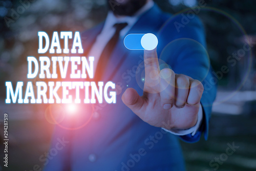 Text sign showing Data Driven Marketing. Business photo text Strategy built on Insights Analysis from interactions Male human wear formal work suit presenting presentation using smart device photo