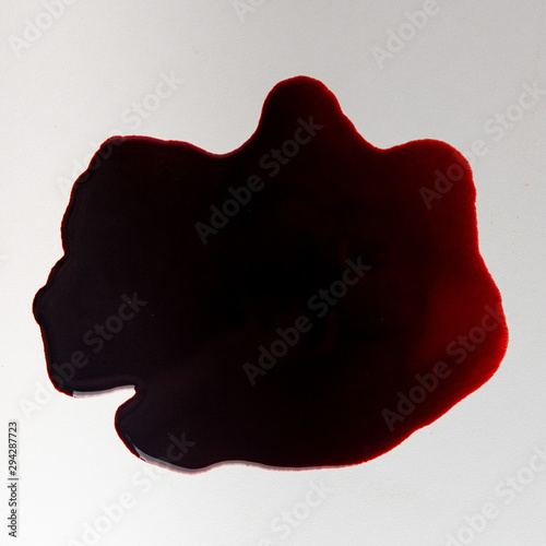 dark pool of blood on a white surface