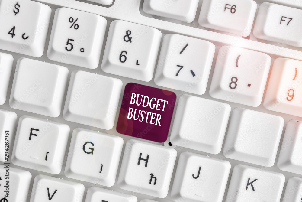 Text sign showing Budget Buster. Business photo text Carefree Spending Bargains Unnecessary Purchases Overspending White pc keyboard with empty note paper above white background key copy space Text sign showing Budget Buster. Business photo text Carefree Spending Bargains Unnecessary Purchases Overspending White pc keyboard with empty note paper above white background key copy space