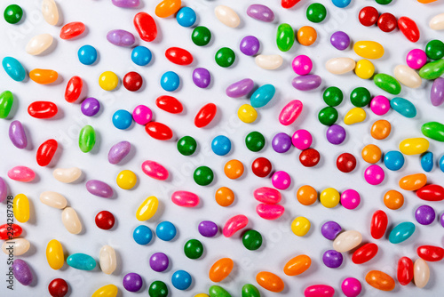 Halloween and decoration concept, Colorful candy scattered on gray background.