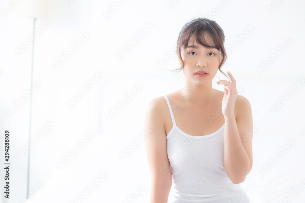 Portrait of beautiful young asian woman makeup of cosmetic, girl happy and smile attractive, face of beauty perfect with wellness in the bedroom at home with skin care and healthcare concept. Portrait of beautiful young asian woman makeup of cosmetic, girl happy and smile attractive, face of beauty perfect with wellness in the bedroom at home with skin care and healthcare concept.