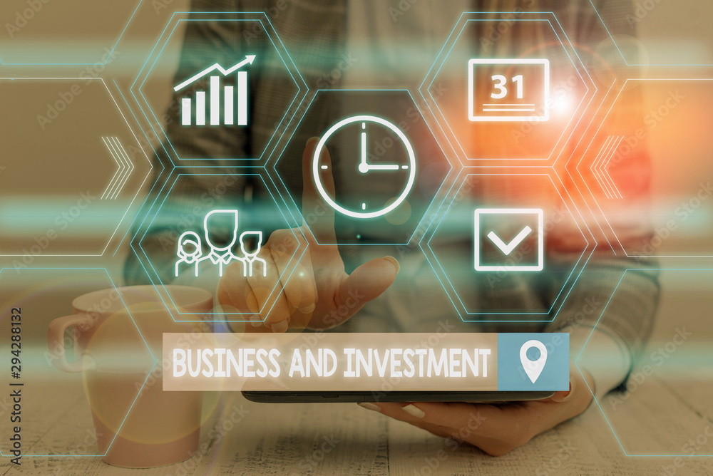 Fototapeta premium Word writing text Business And Investment. Business photo showcasing putting your money in field to increase them Woman wear formal work suit presenting presentation using smart device
