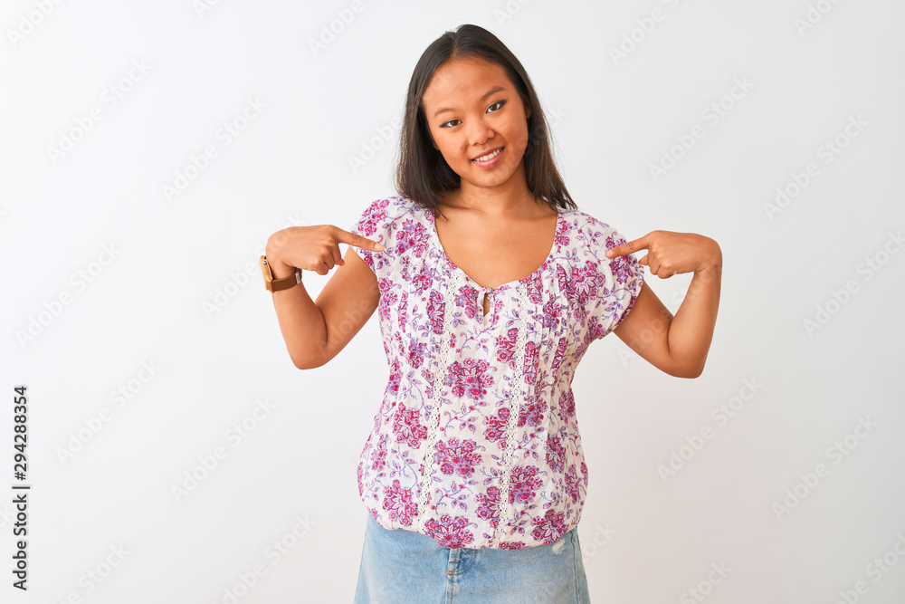 Young chinese woman wearing casual floral t-shirt standing over isolated white background looking confident with smile on face, pointing oneself with fingers proud and happy. Young chinese woman wearing casual floral t-shirt standing over isolated white background looking confident with smile on face, pointing oneself with fingers proud and happy.