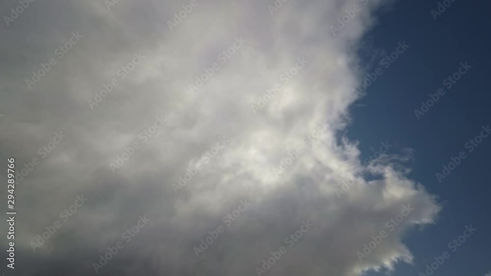 Looking up into the sky with a cloud cover that dissolves, Timelapse 4k