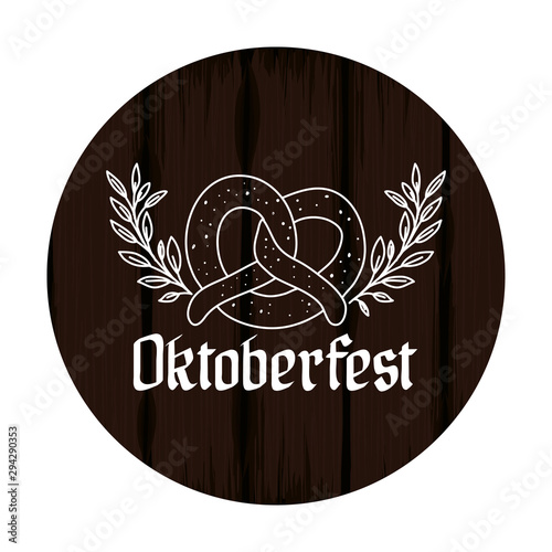 delicious pretzel with calligraphy and wooden background