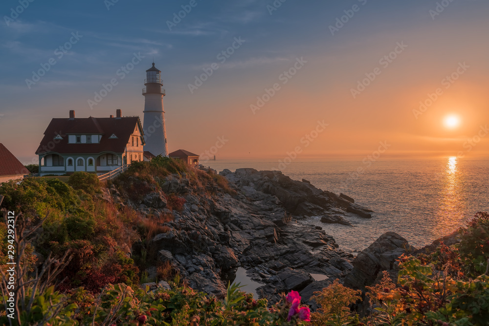 Magical sunrise at the iconic Portland Head Light. Portland, Maine
