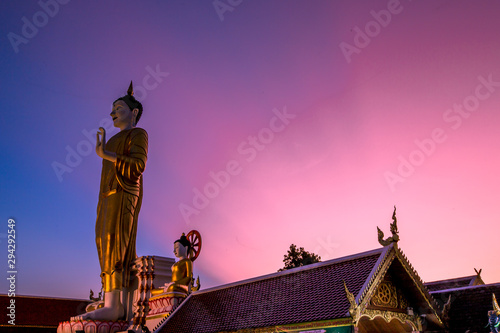 Wat Phra That Doi Kham-Chiang Mai: 17 September 2019, a group of tourists come to see the scenery and make merit on the way inside the temple on the foot of a mountain, Mae Hia, Thailand. photo