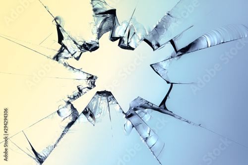 A splintered glass with a hole. Concept: broken glass