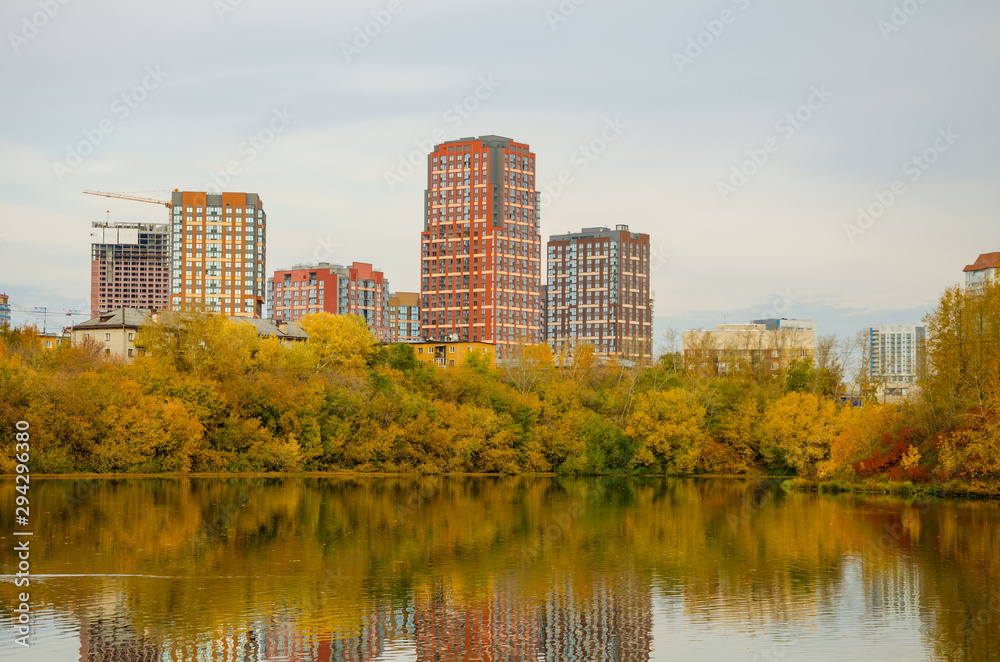 New residential high-rise buildings near the lake in the autumn.