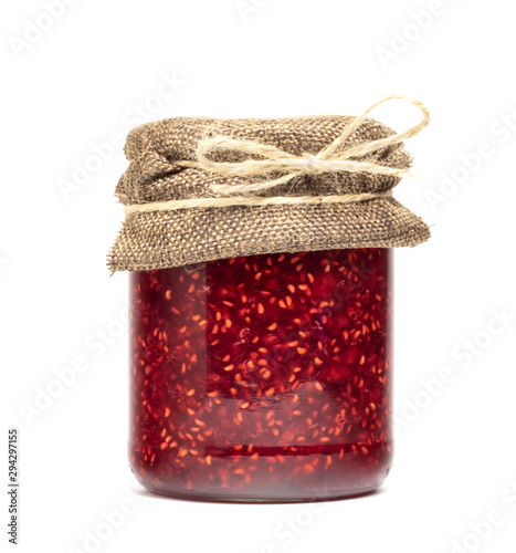  raspberry jam in a jar on a white background