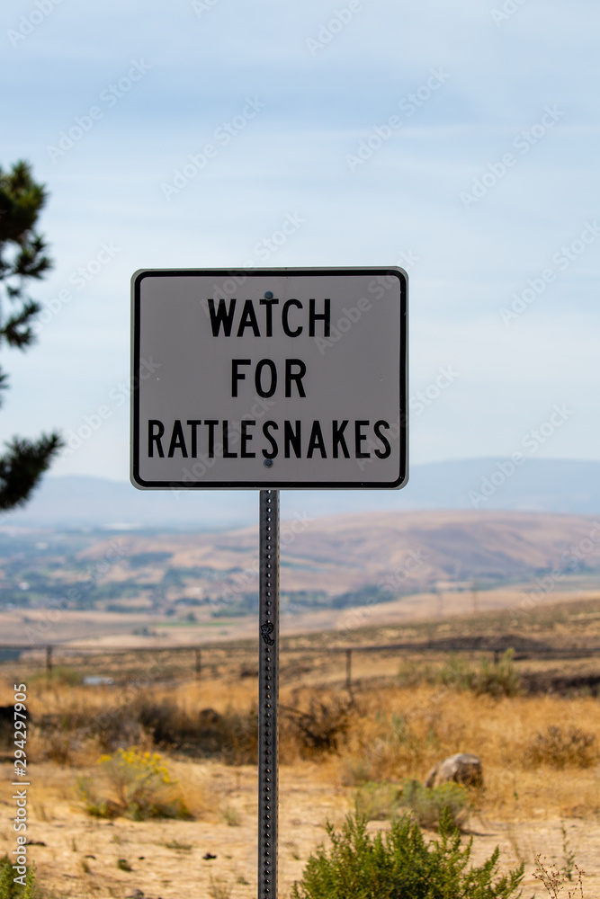Watch for rattlesnakes sign posted in the state of Washington Watch for rattlesnakes sign posted in the state of Washington