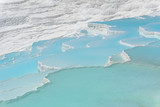 Natural travertine pools and terraces view from Pamukkale, Denizli, Turkey. Cotton castle close up view.