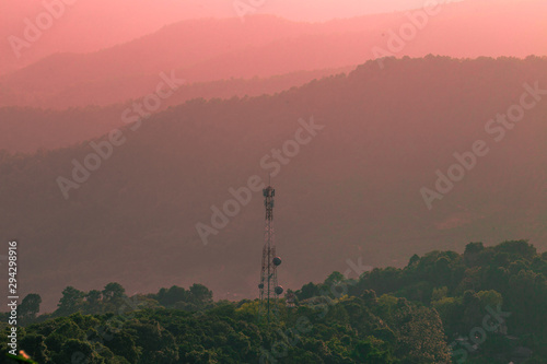 Wide natural background blurred by the bright sunlight above the mountains during the reversal of the horizon, beautiful twilight light, cold wind blowing through, fresh air © bangprik