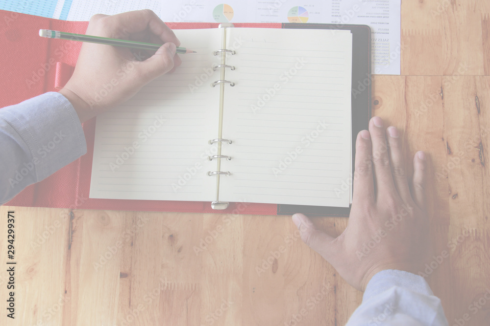 Man Writing with document at work office Man Writing with document at work office