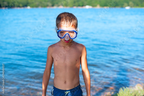 Boy in a diving mask on the beach Sea tourism travel