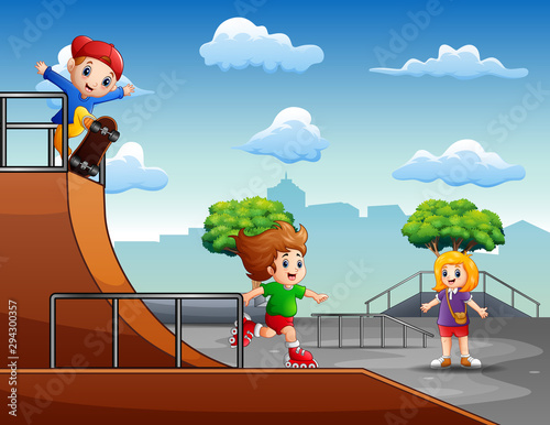 Happy children riding a roller blades and skateboard
