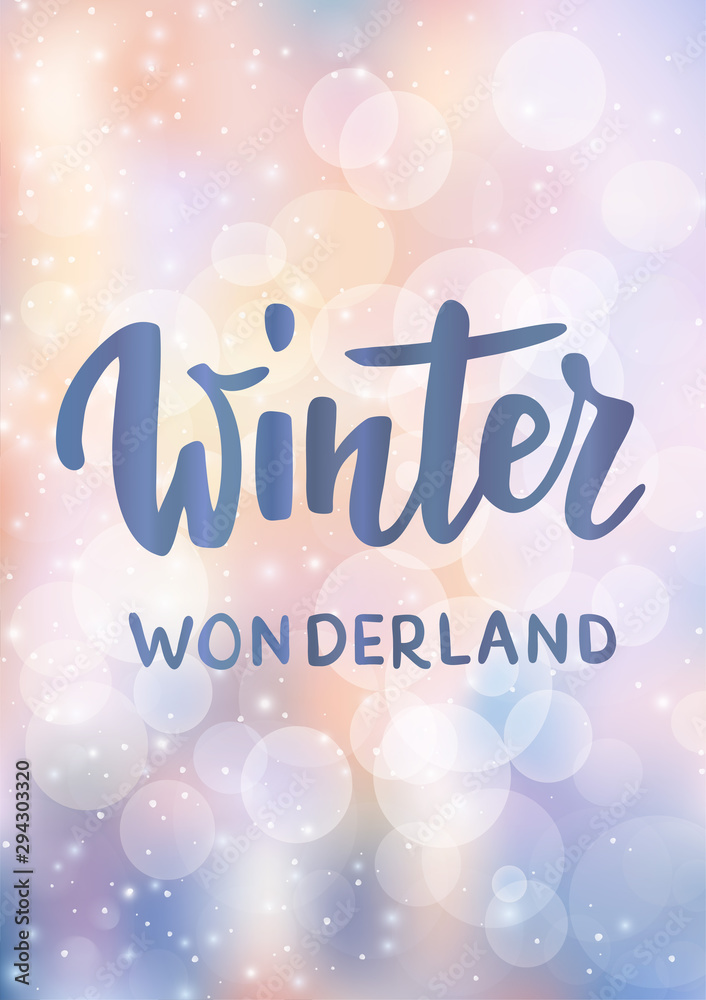 Christmas card. Winter wonderland hand drawn text. Sparkling glowing lights. Background with bokeh effect.