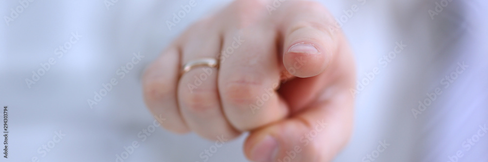 Naklejka premium Male arm point forefinger to you or camera during conference conversation in office closeup. Suggestion illustrate offer proposition bribe demand boss advisor idea concept