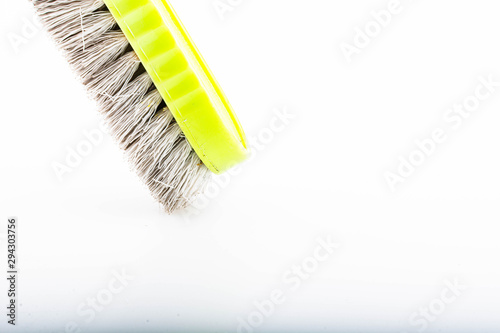 Close-up dirty clothes brush isolated on a white background
