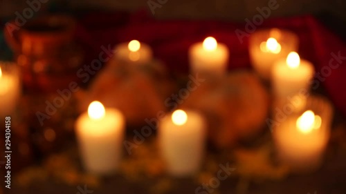 Blurry candles in day of the dead altar