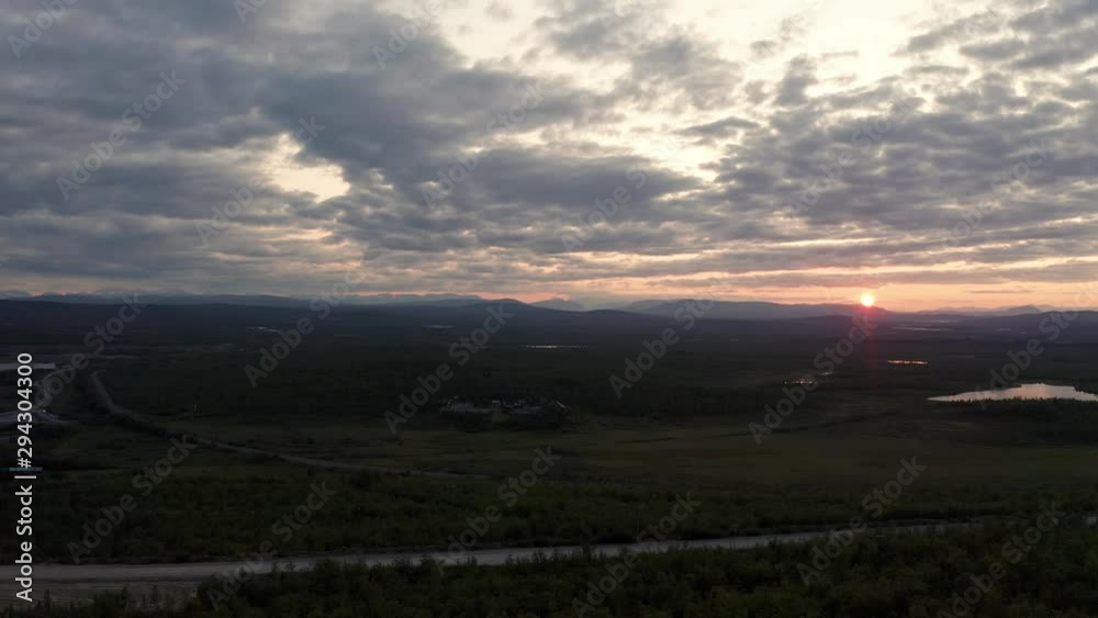 Drone shot of Kiruna Lapland countryside during sunset with mountains on the horizon Drone shot of Kiruna Lapland countryside during sunset with mountains on the horizon