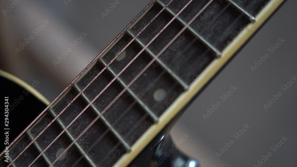 Close up view of six strings of acoustic guitar Close up view of six strings of acoustic guitar